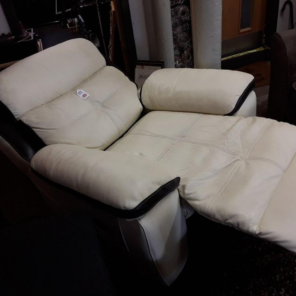 This very large cream and black well-made real leather electric reclining armchair is in good overall used condition. There are some dints in the leather in places through but no rips or tears...The back also comes off. It reclines into an almost vertical position.

44 inches wide x 3 ft deep x 40 inches high.

Our second hand furniture mill shop is LOW COST MOVES, at St Paul's trading estate, Copley Mill, off Huddersfield Road, Stalybridge SK15 3DN...Delivery available for an extra charge.

There are some large metal gates next to St Paul's church... Go through them, bear immediate left and we are at the bottom of the slope, up from the red steps...

If you are interested in this or any other item, please contact me on 07734 330574, or on the shop 0161 879 9365...Many thanks, Helen.

We are normally OPEN Monday to Friday from 10 am - 5 pm and Saturday 10 am - 3.30 pm.. CLOSED Sundays. CLOSED Bank Holiday long weekends...
