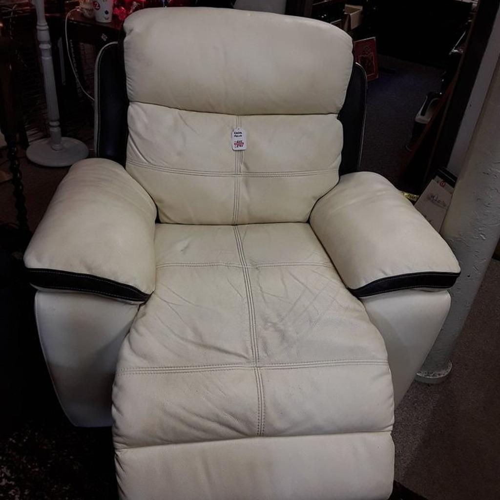 This very large cream and black well-made real leather electric reclining armchair is in good overall used condition. There are some dints in the leather in places through but no rips or tears...The back also comes off. It reclines into an almost vertical position.

44 inches wide x 3 ft deep x 40 inches high.

Our second hand furniture mill shop is LOW COST MOVES, at St Paul's trading estate, Copley Mill, off Huddersfield Road, Stalybridge SK15 3DN...Delivery available for an extra charge.

There are some large metal gates next to St Paul's church... Go through them, bear immediate left and we are at the bottom of the slope, up from the red steps...

If you are interested in this or any other item, please contact me on 07734 330574, or on the shop 0161 879 9365...Many thanks, Helen.

We are normally OPEN Monday to Friday from 10 am - 5 pm and Saturday 10 am - 3.30 pm.. CLOSED Sundays. CLOSED Bank Holiday long weekends...