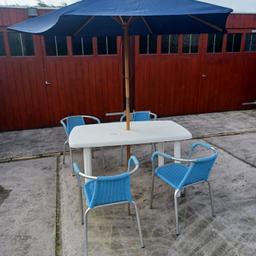 White plastic garden table with removable legs for easy storage, 4 stackable blue rattan & metal chairs & 1 Navy blue wooden umbrella (four extra matching chairs also listed) collection only from Rainhill L35