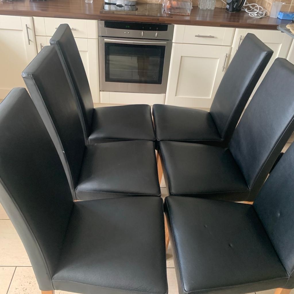 Excellent condition 6 black padded chairs with wooden legs hardly used