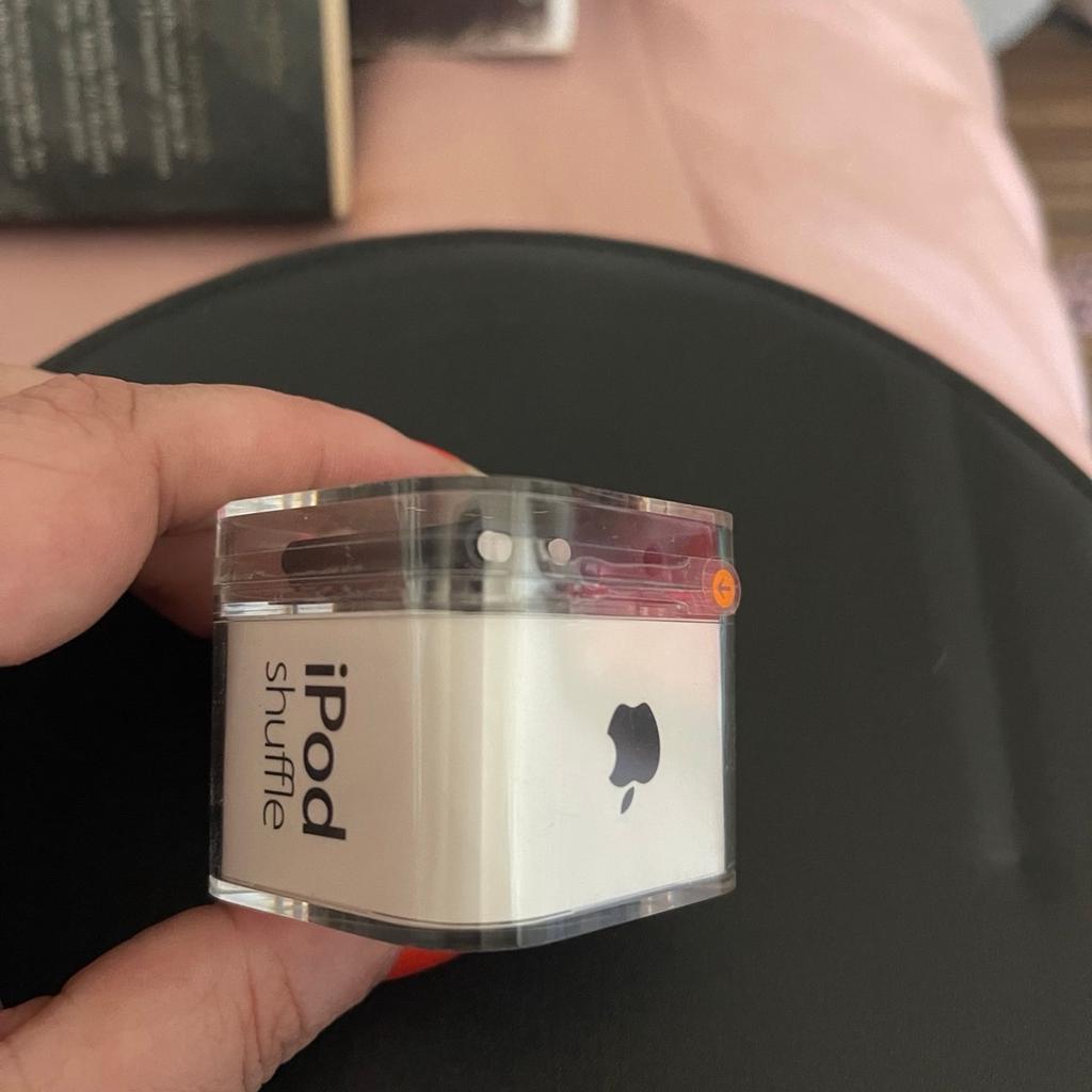 Brand new. Still in original box and sealed with the original tape.

2gb iPod shuffle in black.

Comes with iPod, charging cable and headphones in the sealed unit.

Perfect for a collector or iPod lovers!