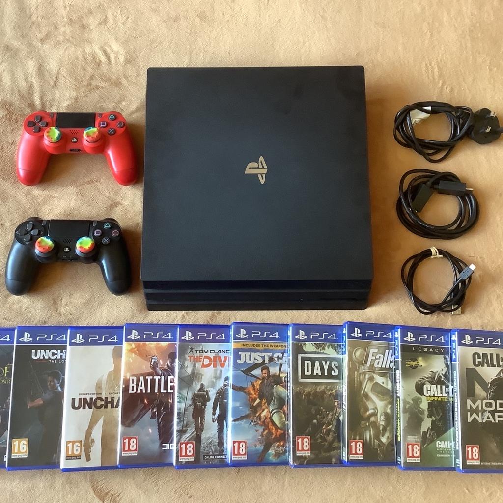 PlayStation PS4 Pro, 1 TB. Jet Black. Boxed with 10 games. Power cable, controller charging cable, HDMI and 2 genuine PS controllers. Any questions answered. Excellent condition. Can ship at a cost.
