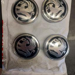 4 vauxhall wheel centre caps.56mm diameter. bought but never used. 1 small tag broken. any questions please ask