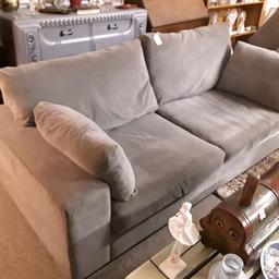 Large grey fabric three-seater sofa in good, clean all-round condition. Soft to sit on...

80 inches long x 37 inches deep x 33 inches high.

Our second hand furniture mill shop is LOW COST MOVES, at St Paul's trading estate, Copley Mill, off Huddersfield Road, Stalybridge SK15 3DN... Delivery available for an extra charge.

There are some large metal gates next to St Paul's church... Go through them, bear immediate left and we are at the bottom of the slope, up from the red steps... 

If you are interested in this or any other item, please contact me on 07734 330574, or on the shop 0161 879 9365...Many thanks, Helen. 

We are OPEN Monday to Friday from 10 am - 5 pm and Saturday 10 am - 3.30 pm... CLOSED Sundays. CLOSED Bank Holiday long weekends...