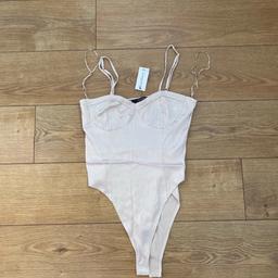 New with tags 
Gold silky bodysuit from primark 
Size 14