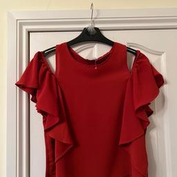 Womens top in rust colour sheet fabric at the front and frill down sides.soft stretchy fabric at the back.size 8.from Zara new item 