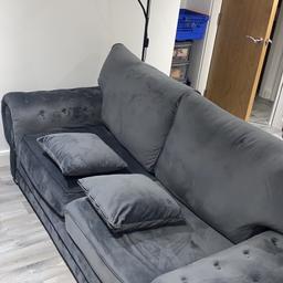 Amazing chesterfield two seater sofa with suede finish, includes Ottoman for reasonable price.