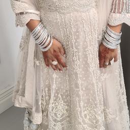 bought this dress from mongas for my sons wedding only worn once ..its so elegant so heavy.. its a creamy white.. it so beautiful.   size 12