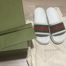 Gucci web sliders in the colour white, worn many times, red and green strip has a few marks
