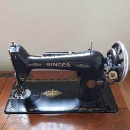 A used mounted singer treadle sewing machine.