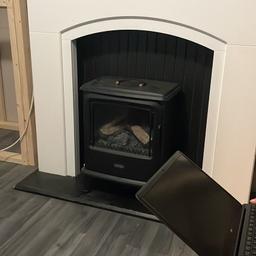 Black electric fire with steam and realistic fire effect, excellent condition with controller, black and white fire surround has a little damage to bottom cornors but otherwise good condition.
Just a little dusty from building works.