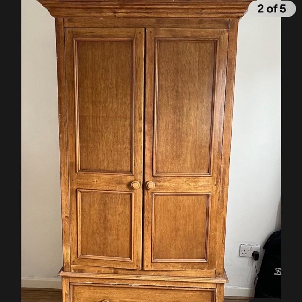 Collection of Wallis & Gambier Bedroom Furniture.
Comprises of 2x Wardrobes, with a Deep Drawer to the bottom, 1x Tall Boy with 4 +2 Drawers, & 1x Bedside unit with 3 Drawers.
All in good condition, however, 1 of the wardrobes has a broken hinge on the bottom right door.

Will separate if required.