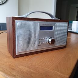Digital DAB/FM Radio
Make - Red
Silver front with Wooden surround 
Model 583 151
Mains or Battery operated 
Excellent condition 
Collection only
