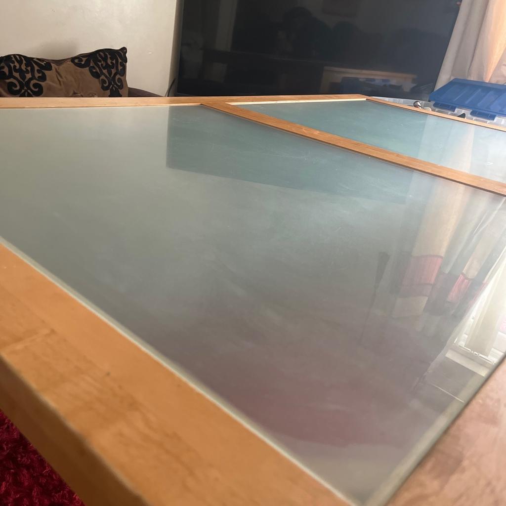 Pine wood panelled table with double pane frosted glass