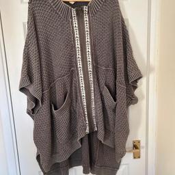 Excellent condition…. 
It is an oversized poncho sweater..
Quite heavy…..
Labels says xs/s, however still fit perfectly and oversized on me as someone who wears L/XL. Definitely listing it as one size , see measurements below.
Bust:105cm
Lenght:85cm