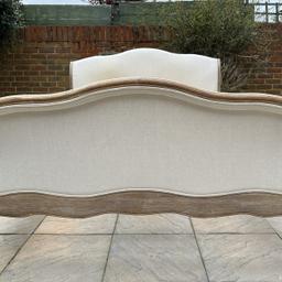 This hugely popular, stunning and great quality Loaf Antoinette French Sleigh Solid Oak king size Bed-frame in a good used condition overall, with some marks / stains, on fabric, you may either professionally clean or re-upholstery it and the rest is in superb condition and it’s and still a statement bed to own. Please see photos.

This French bed is made of solid weathered oak. Upholstered in a natural cotton linen fabric.

Handcrafted by skilled craftsmen in solid weather oak.

Includes sprung support Beech slats system.

Features carved boards, sides and legs.

L: 239cm

W: 164cm

Headboard Height: 117cm

Foot end height: 84cm