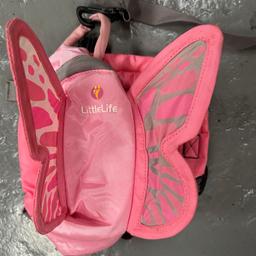 Lovely little pink butterfly backpack with the reigns for parent