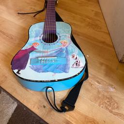 Children’s frozen guitar.it has a few scratches  around the edges but it all in good working order.