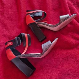 stunning neon orange and silver sandals from Paper Dolls. Perfect for teens and ladies alike, these strappy sandals feature a trendy block heel and are made with faux leather upper material. The bright neon colour is guaranteed to make a statement, while the metallic silver detailing adds a touch of glamour.