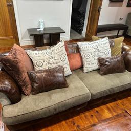 Beautifully crafted half leather half fabric sofas. Very very comfy with minimum wear and tear. Cushions are all well maintained with no stains. These sofas were in my guest Lounge and so have been hardly used. Selling a complete set. Two large sofas. Each sofa seats 4 people