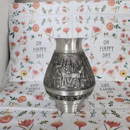 This beautiful pewter jug is from Zinn Becker, Stuttgart, Germany.

it is 95% pewter and would make a lovely decoration ina kitchen. It's 12cm in height.