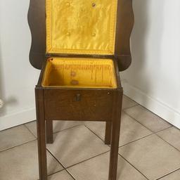 Vintage / retro Sewing side table by Morco which takes the form of a circular side table , beneath the hinged lid is a interior lined with yellow fabric
Viewing welcome