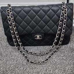 This is a classic Chanel double flap bag in black lambskin - in the practical and elegant small size. It is a vintage piece from before 2008 .

The bag is preloved and does show signs of wear - I have taken this into consideration when pricing it which is the reason why I’m selling at a significantly lower price than the Chanel double flap normally sells for! The going rate of these bags is usually £3k - £5k depending on condition so please bear this in mind. It is still very wearable and in my opinion looks lovely - but it is not pristine and does show signs of wear. Please have a look at the photographs for full details of the condition.


This bag has been given a bag spa treatment and polished with leather polish.The overall finish isnice and shinning due to the glow up it got at the bag spa

Because of the age of the bag, the serial number is no longer intact - there is a tiny amount of residue in the interior corner where it would have originally been.