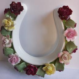 Aynsley Floral Horseshoe. This beautiful vintage Horse Shoe is in lovely condition. Hand Modelled. Fina Bone China. Lovely quality. Good bit of weight. Horseshoe's are supposed to bring Good Luck. Would make an excellent gift for yourself or a loved one. Estimated to have been produced in the 1970s or 1980s due to the floral design. Very few marks for its age. Please see my images for condition.