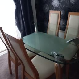 Glass dining table and 4 leather effect chairs. In very good condition.
Table measurements are: Length 150cm, width 90cm and height 77cm. £100. Comes from a smoke and pet free home. Collection from S20 Halfway.