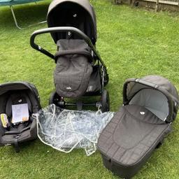 1x Joie Chrome DLX Pavement Travel System, including: 1x chassis, 1x reversible pushchair seat unit, and 1x carry cot 1x carseat

UPF 50+ extendable canopy, removable bumper bar, height adjustable handle, 1x shopping basket, 1x rain cover, and car seat adaptors

Assembled dimensions: 86L x 59.8W x 113.2H cm

Folded dimensions: 93L x 59.8W x 38.5H cm

Soft touch 5-point safety harness

5-position recline

4-wheel suspension & Lockable front swivel wheels

Ultra compact fold with seat attached

Compatible with Joie Gemm Group 0+ Car Seat Ember (Ref: 8025652) and Joie ISOFix Base (Ref: 153961) sold separately

Birth to 22kg

In the pictures it looks like it’s light grey but it’s more of a dark grey