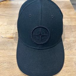 Stone Island Black Cap

100% Authentic, please see certilogo verification in pictures.

Could do with a wipe but no tears or fading.

Unique magnetic size adjust to this cap which you will not see on latest models.

£50