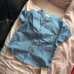 Lovely shirt 12-18 months my son never got around to wearing 
*collection only