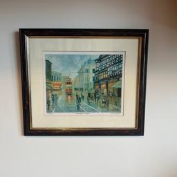 Tom Riley scene of Bolton Lancashire 
Tom Riley Lancashire artist 
Signed print 
Street scene / whitakers department store 
Framed & mounted picture
Deansgate Bolton - T.R.A publications ( copyright)
Frame measures 
Listed on various sites 
From a smoke free pet free home 
14:5” wide x 12.5” high
Mount & images measures 
7:5” high x 9.5” wide