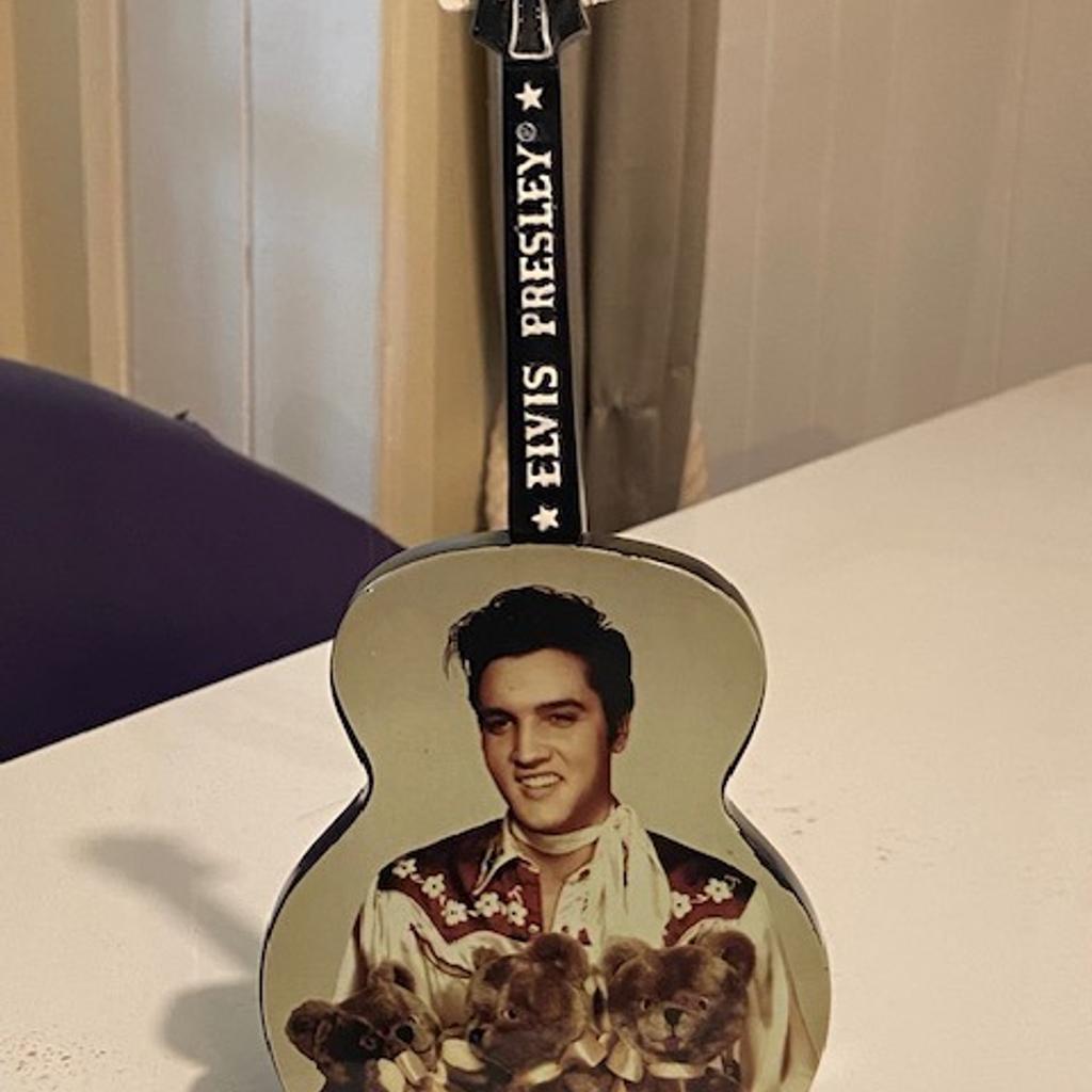 RARE TO FIND THIS IN THE UK IN THIS CONDITION
A freestanding guitar ornament - official release.
This is in stunning condition just one small mark. Works fully and plays the tune of 'Teddy Bear' when wound up.
23cm high x 10cm wide
I have sold over 3500 Elvis items (!) with a positive feedback score of 100% so you are in safe hands!
And as my regular customers know I only post the highest quality items. So yes may cost more but you have guarantee of quality from a specialist Elvis seller. Please feel free to visit my page and read reviews.
I also have the largest number of Elvis items for sale. The spectrum includes…..DVDs, CDs, VHS, tapes, records, magazines, books, rare concert CDs….and MANY MORE RARE ITEMS…..AND MORE!!
Be quick and good luck!
REF: 10
