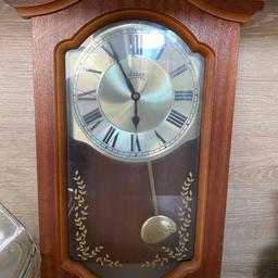 Wooden wall clock, with hourly chime