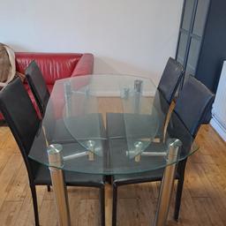 glass dinning table with four chairs