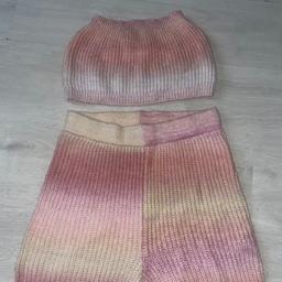 Elevate your summer wardrobe with this chic Ladies Knitted Bandeau & Shorts Set. The set boasts a multi-coloured knit design that will make you stand out from the crowd. It’s perfect for any occasion, from casual gatherings to beach parties, and is available in a medium size. 

The set includes a stylish pair of shorts and a comfortable bandeau top that will keep you cool in the heat. Ideal for women who love to stay fashionable and comfortable at the same time. Get this brand new outfit without tags today and be the envy of your friends.