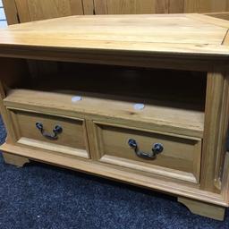 Solid oak TV stand in great condition. A heavy piece of quality furniture. It has 2 solid storage drawers in the base and 2 display shelves with a concealed hole at the back for wires to be hidden. The unit measures 102cm wide x 50cm deep x 60cm tall. Viewing/collection is Leeds LS24 & delivery is available if required - £125