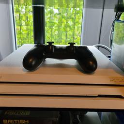 ps4 pro white,with controller and 10 games,very good condition,only selling as don't play on it anymore unfortunately
