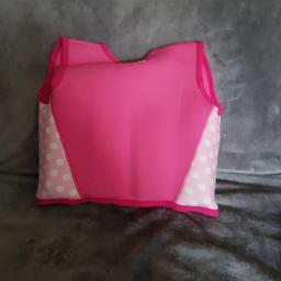 a pink Mothercare swimming  flotation vest designed for a 4-5 year old.
as good as new.
a pair of pink dragonfly armbands, only been used a few times