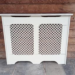 white radiator cover. mdf framework with hardboard lattice panels. some small scuffs and scratches, could do with touching up or repainting. 40 inch top shelf, 38 inch outside body, 36.5 inch inside body x 6.5 inch outside depth, 5 inch inside depth. mounting brackets included. can deliver locally. cash only please.