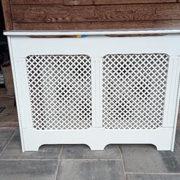 white radiator cover. mdf framework with hardboard lattice panels. some minor scuffs and scratches, could do with touching up or repainting. top shelf 47 inches. outside frame 45.5 inches. inside frame 44 inches. outside depth 7 inches. inside depth 6 inches. mounting brackets included. can deliver locally. cash only please.
