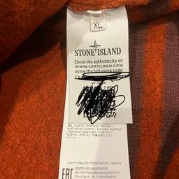 This is a brand new item never worn still with the original tags. It is in a burnt Orange colour way and is made from Wool. It is a size XL.