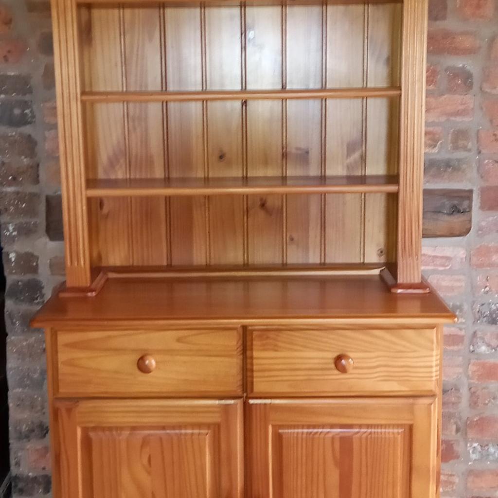 small pine dresser. good condition with minimal marking. removeable cupboard shelf. 3 display shelves with 3 height options each. 2 drawers, 14 x 12 x 5 inches inside measurements. nice, solid piece of traditional furniture. width 37 inches, height 71 inches, depth 18 inches. can deliver locally. cash only please.