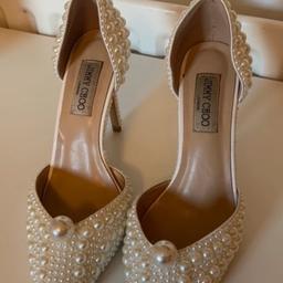 Beautiful cream pearl heels. 
Worn once so very minor wear only to soles 
Size 6 uk