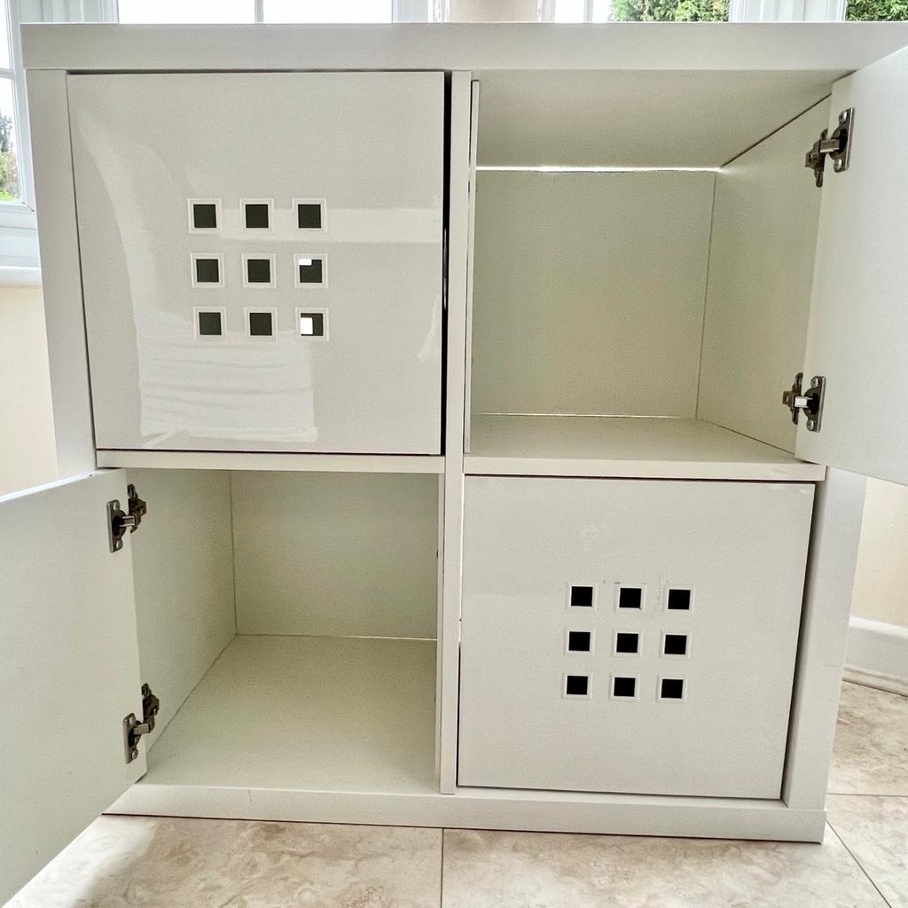 Square White IKEA Kallax unit with 2 white gloss doors and 2 removable inserts (also in white gloss).
77 cm x 77 cm x 39 cm deep
Used but in very good condition, with no flaws.
Looks great in any room and ideal for storage.