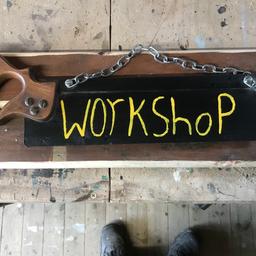 Double sided sign made from vintage saw