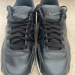 Black Nike Air trainers in perfect condition hardly worn like new.