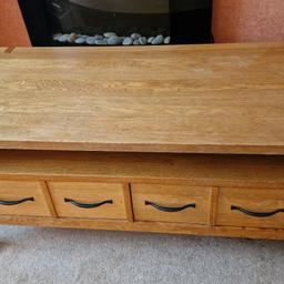 Wooden oak coffee table bought from Next. few marks of wear and tear as shown. Otherwise very good condition. Brand new worth £399.99.