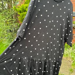 Gorgeous ASOS summer dress. Short sleeved black dress with cute white polka dots and a frill hemline. Cute and very comfortable. Great dress for summer days.